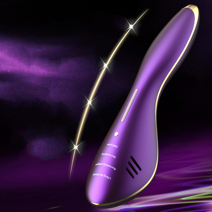 Ergonomic purple and gold facial massager with mode labels and a control button.