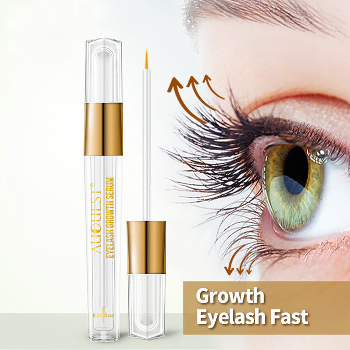 AuQuest clear and gold eyelash serum tube with applicator wand beside a close-up of long eyelashes.