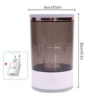 Cylindrical makeup brush cleaner with a translucent gray body, white base, and power button, measuring 9x16cm.