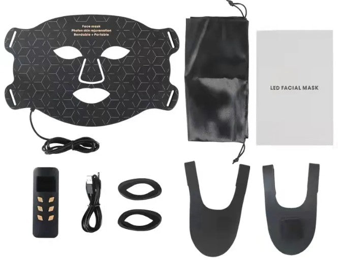 Black flexible LED therapy face mask with controller, charging cable, eye shields, straps, storage pouch, and manual.