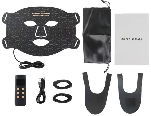 Black flexible LED therapy face mask with controller, charging cable, eye shields, straps, storage pouch, and manual.