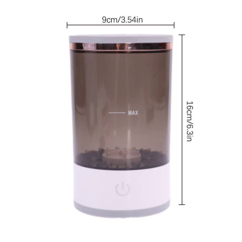 Cylindrical makeup brush cleaner with a translucent grey body, white base, and power button, measuring 9x16cm.