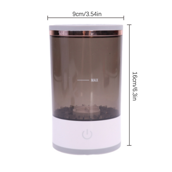Cylindrical makeup brush cleaner with a translucent grey body, white base, and power button, measuring 9x16cm.