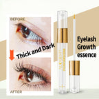 AuQuest Eyelash Serum in a clear tube with gold accents and an applicator brush next to it.