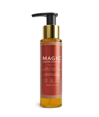 A clear pump bottle of Magic Luxury Body Oil with a red label, gold accents, and white text.