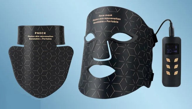 Black flexible LED face and neck mask with gold geometric patterns and a handheld remote controller.